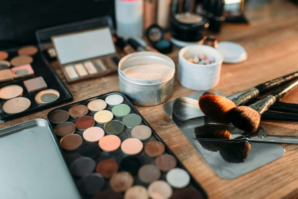 Collection of cosmetology tools on wooden table