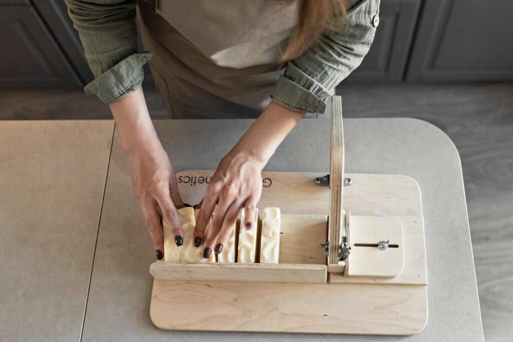 Soap making is handmade . Cutting the finished soap into pieces